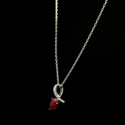 Pear shaped ruby and diamond pendant in 18K white gold