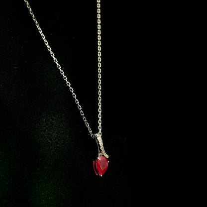 Pear shaped ruby and diamond pendant in 18K white gold