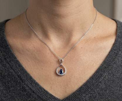 Pear shaped blue sapphire and diamond teardrop pendant in 18K white gold without chain