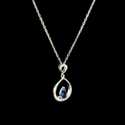 Pear shaped blue sapphire and diamond teardrop pendant in 18K white gold without chain