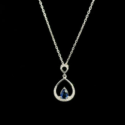 Pear shaped blue sapphire and diamond teardrop pendant in 18K white gold without chain