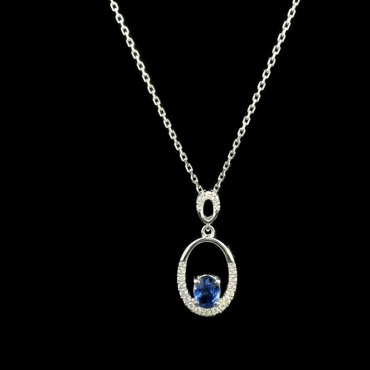 Oval blue sapphire and diamond pendant in 18K white gold with open oval design