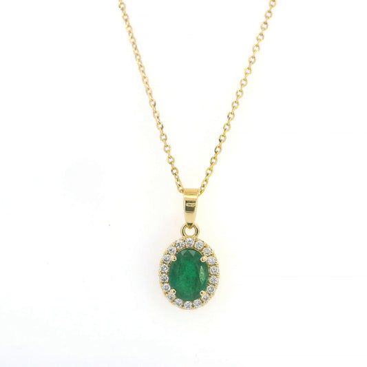 Oval emerald and diamond halo pendant in 18K yellow gold featuring a 1.30 carat green emerald surrounded by round diamonds totalling 0.23 carat. 