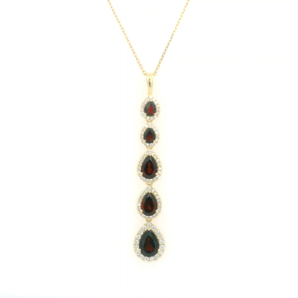 18K yellow gold garnet and diamond drop pendant featuring five pear shaped red garnets totalling 2.26 carats, each surrounded by a halo of round diamonds totalling 0.36 carat. Chain not included.