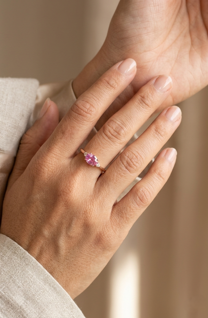 Oval pink sapphire ring with diamond accents in 18K rose gold by Emirates Diamonds