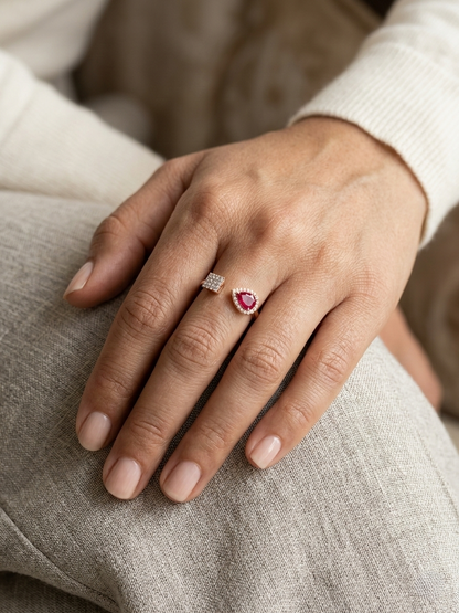Ruby and diamond open ring in 18K rose gold with pear-shaped ruby and pavé diamond accent – Emirates Diamonds