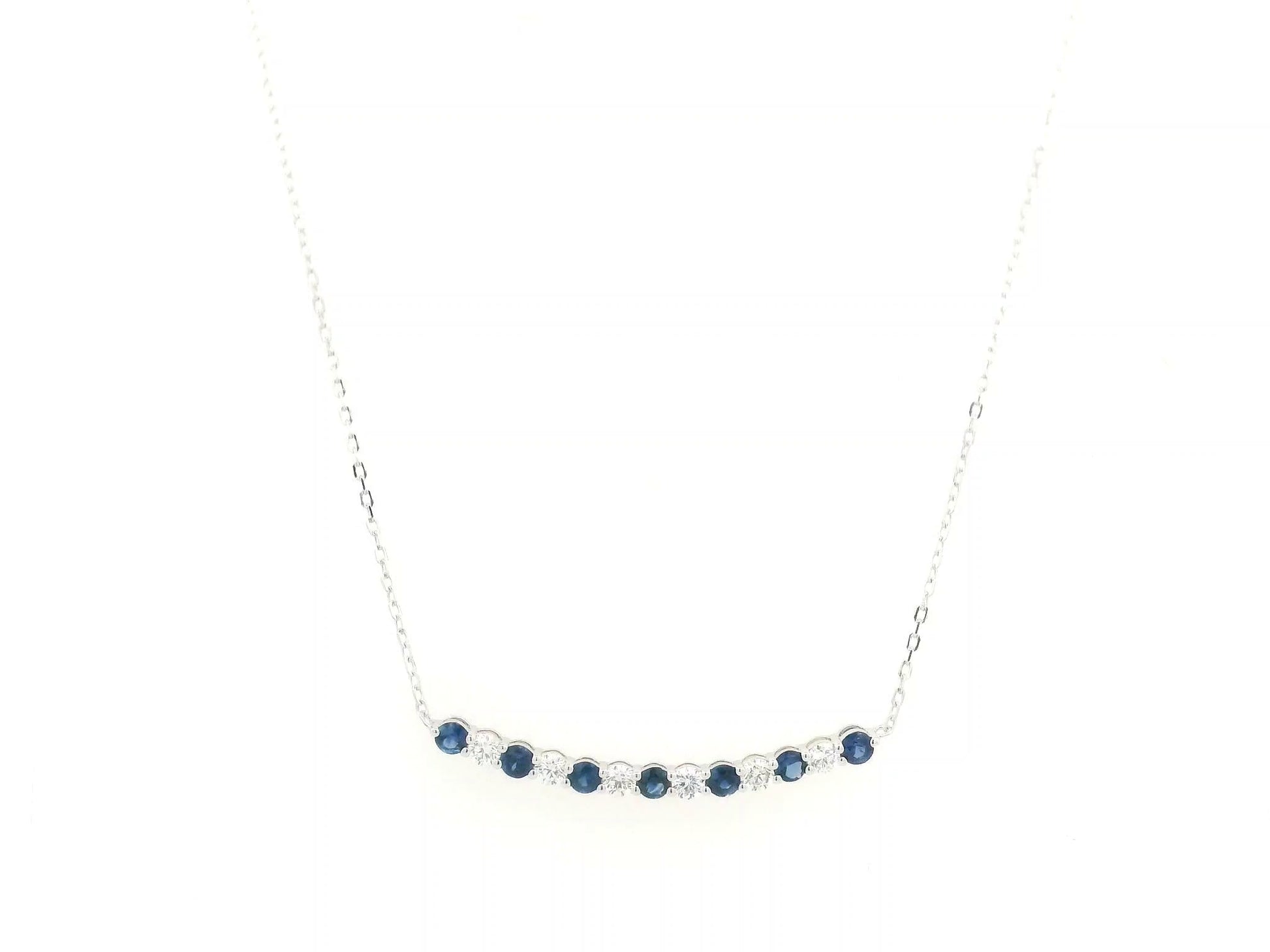 Blue sapphire and diamond bar necklace in 18K white gold featuring 0.74 carats of sapphires and 0.55 carats of diamonds by Emirates Diamonds.