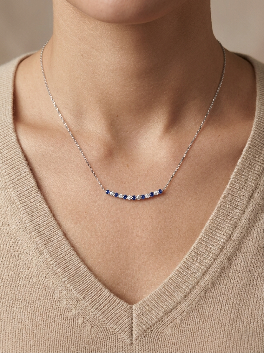 Blue sapphire and diamond bar necklace in 18K white gold featuring 0.74 carats of sapphires and 0.55 carats of diamonds by Emirates Diamonds.