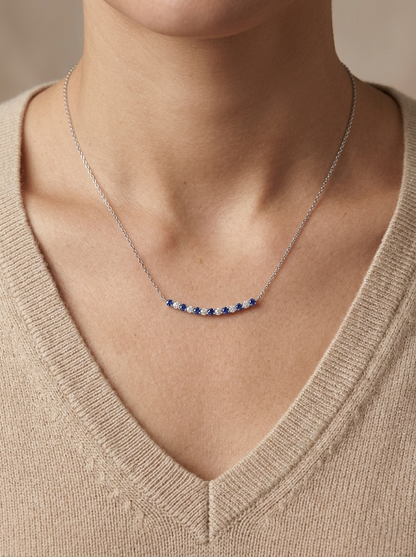 Blue sapphire and diamond bar necklace in 18K white gold featuring 0.74 carats of sapphires and 0.55 carats of diamonds by Emirates Diamonds.
