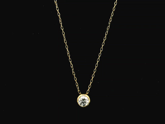 18K yellow gold diamond solitaire necklace featuring a 0.43 carat natural diamond in a modern bezel setting.