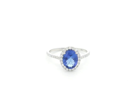 Tanzanite and diamond halo ring in 18K white gold oval gemstone design