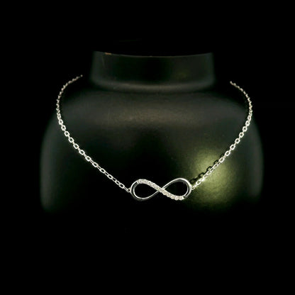 Diamond infinity bracelet in 18K White Gold featuring a pavé-set infinity motif with 0.05 carat natural diamonds.