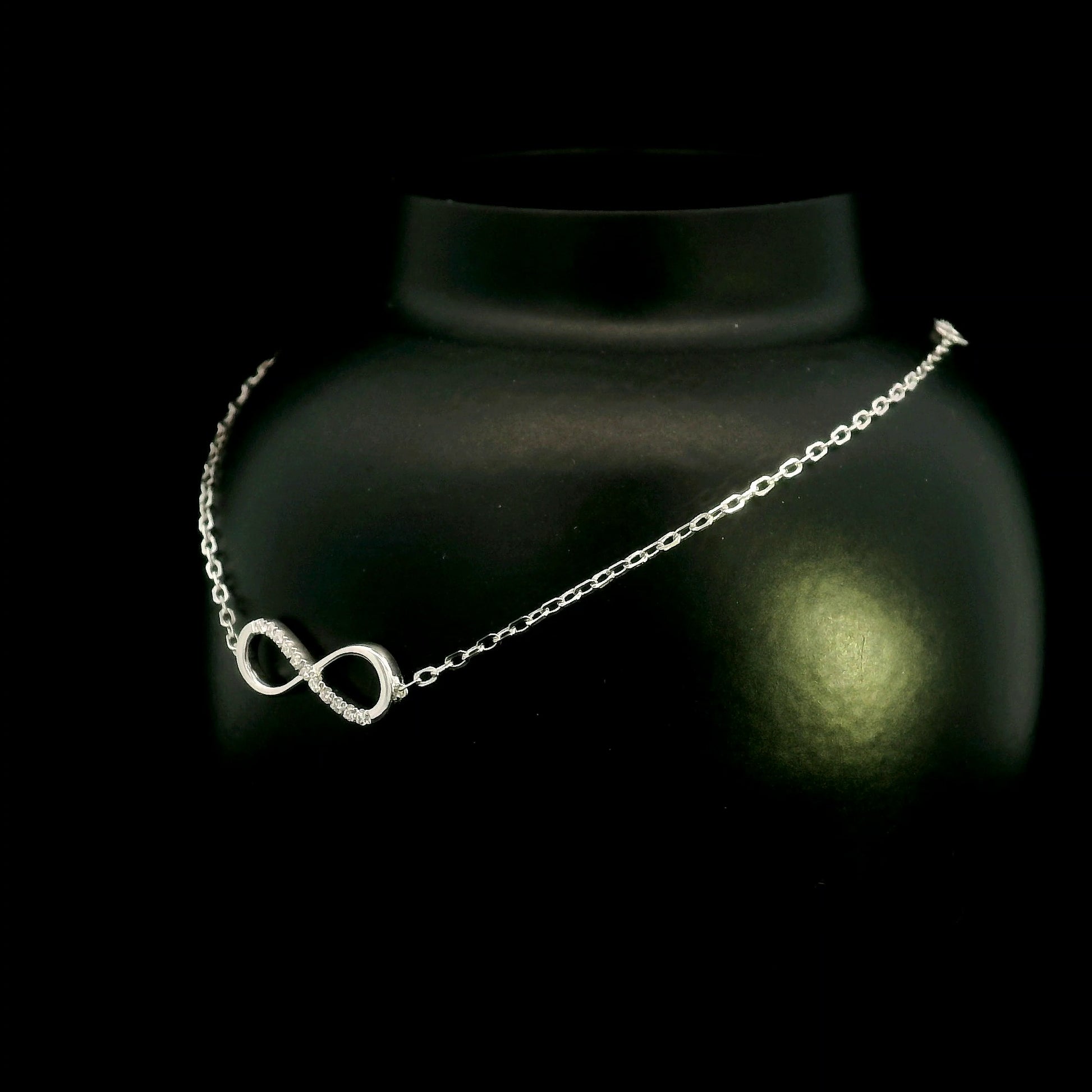 Diamond infinity bracelet in 18K White Gold featuring a pavé-set infinity motif with 0.05 carat natural diamonds.