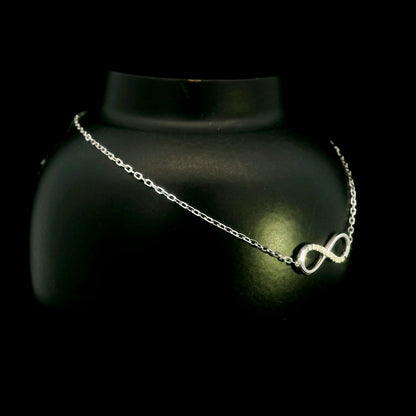 Diamond infinity bracelet in 18K White Gold featuring a pavé-set infinity motif with 0.05 carat natural diamonds.