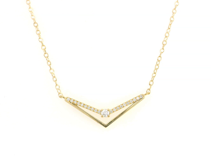 18K gold chevron diamond necklace with 0.16 carats of pavé diamonds on a V-shaped pendant, set on a delicate gold chain.