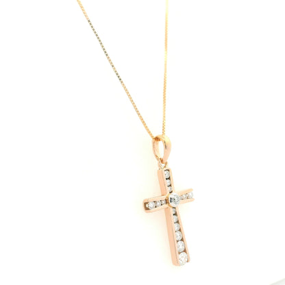 Diamond cross pendant in 18K rose gold with round brilliant diamonds and graduated diamond detailing