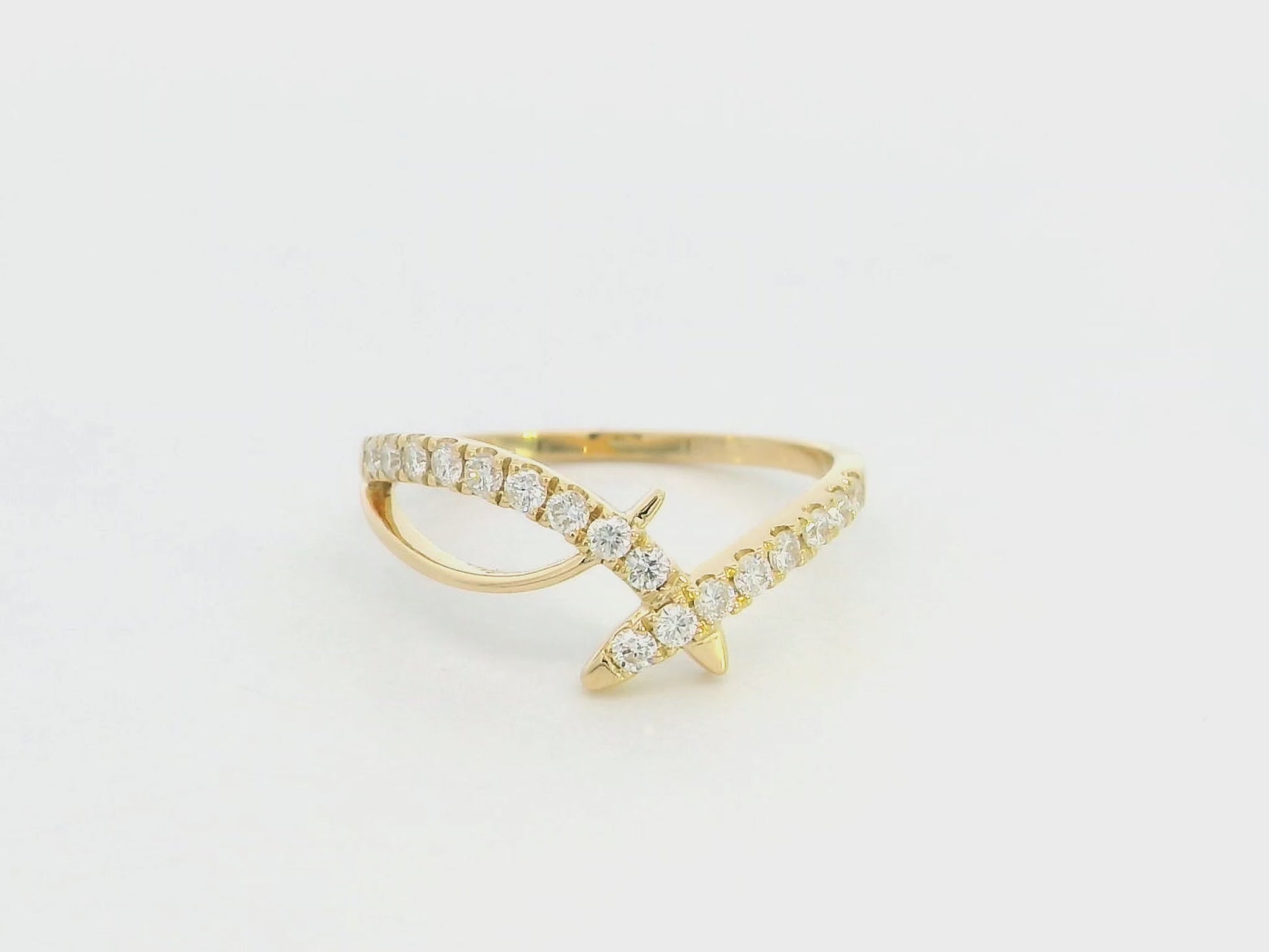 Diamond criss cross ring in 18K yellow gold by Emirates Diamonds