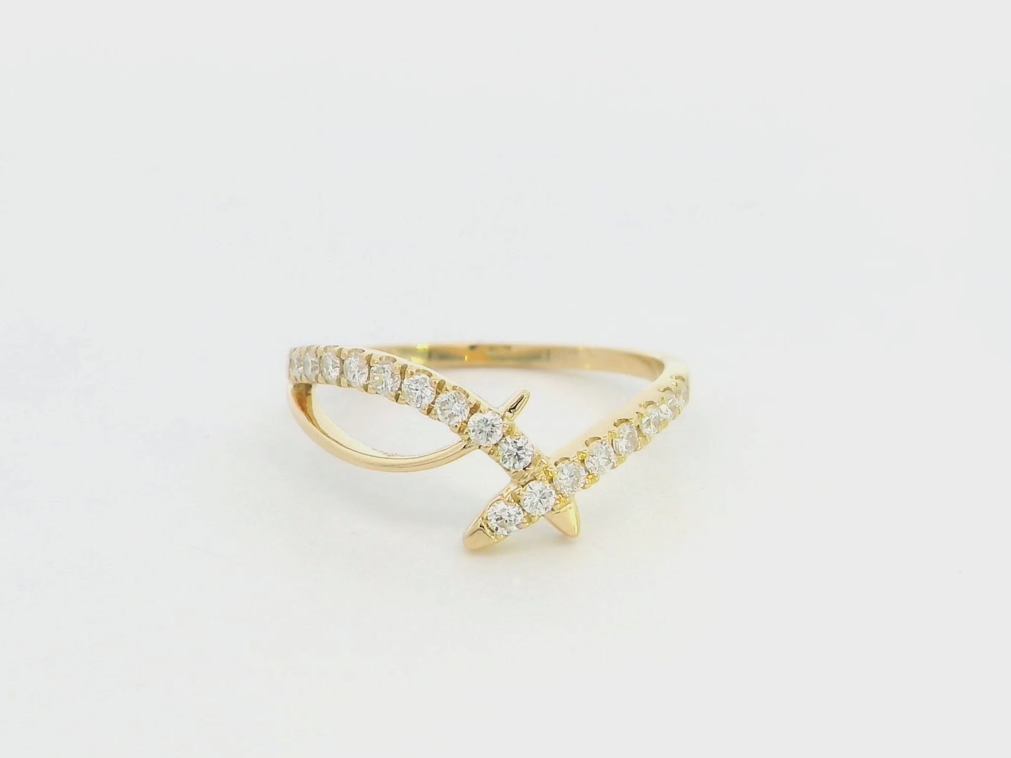 Diamond criss cross ring in 18K yellow gold by Emirates Diamonds