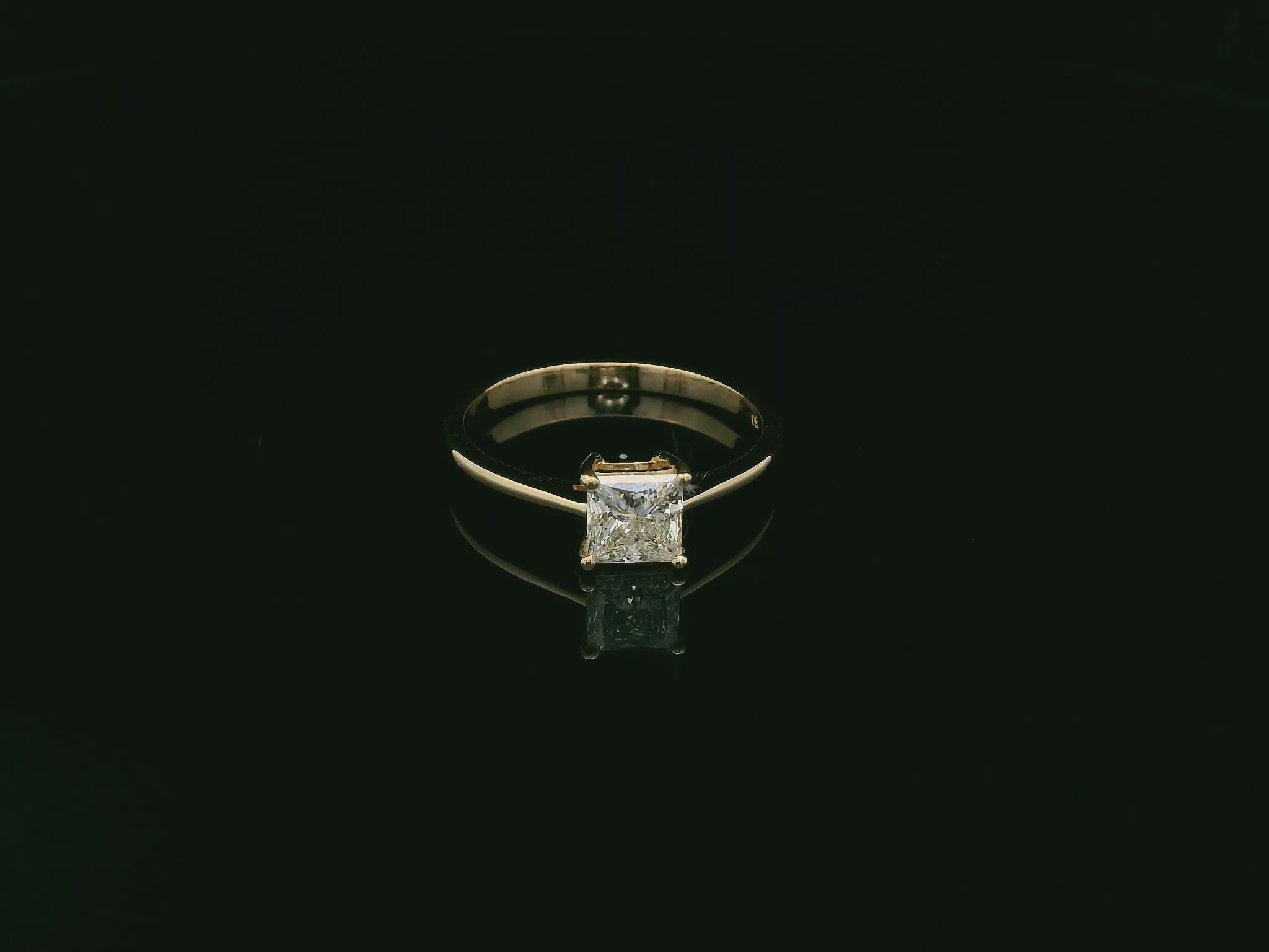 Princess cut diamond solitaire ring in 18K yellow gold by Emirates Diamonds