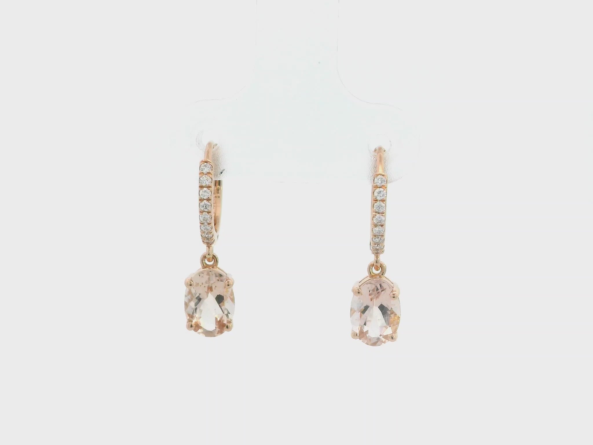 18K rose gold drop earrings featuring oval-cut morganite gemstones with diamond-accented hoops by Emirates Diamonds.
