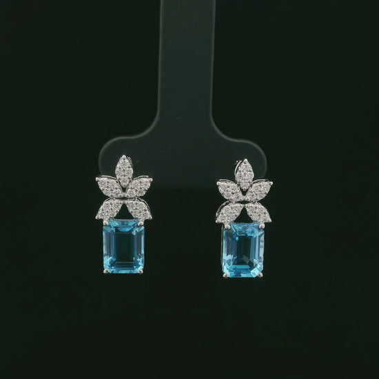 18K white gold Swiss blue topaz and diamond stud earrings with  diamond floral design – Emirates Diamonds