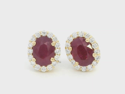 Oval Ruby With  Diamond Halo Earrings In 18k Yellow Gold.