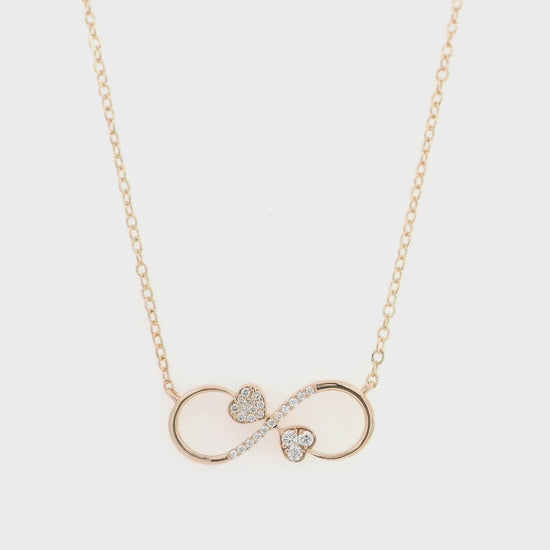 18K rose gold infinity heart necklace with pavé diamonds and double heart design.
