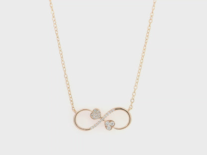 18K rose gold infinity heart necklace with pavé diamonds and double heart design.