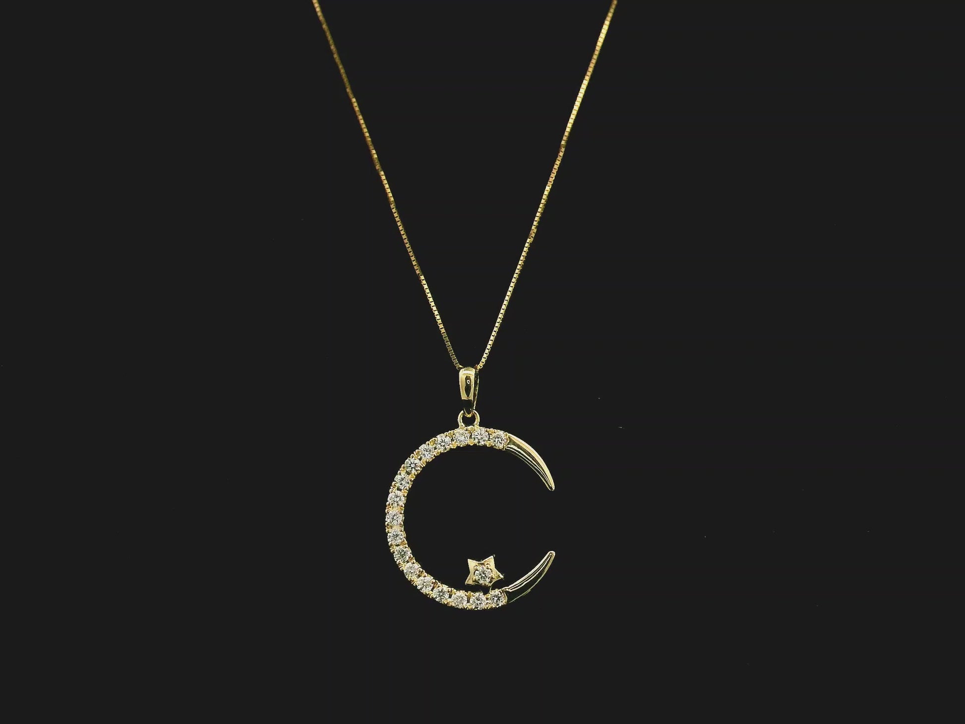 Diamond crescent moon pendant in 18K yellow gold by Emirates Diamonds