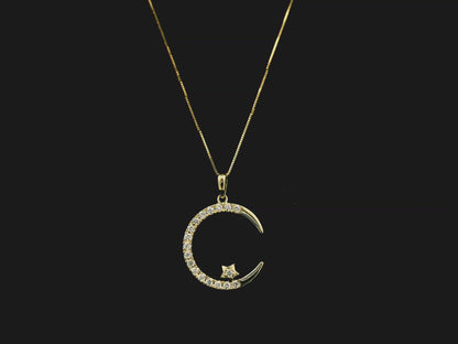 Diamond crescent moon pendant in 18K yellow gold by Emirates Diamonds