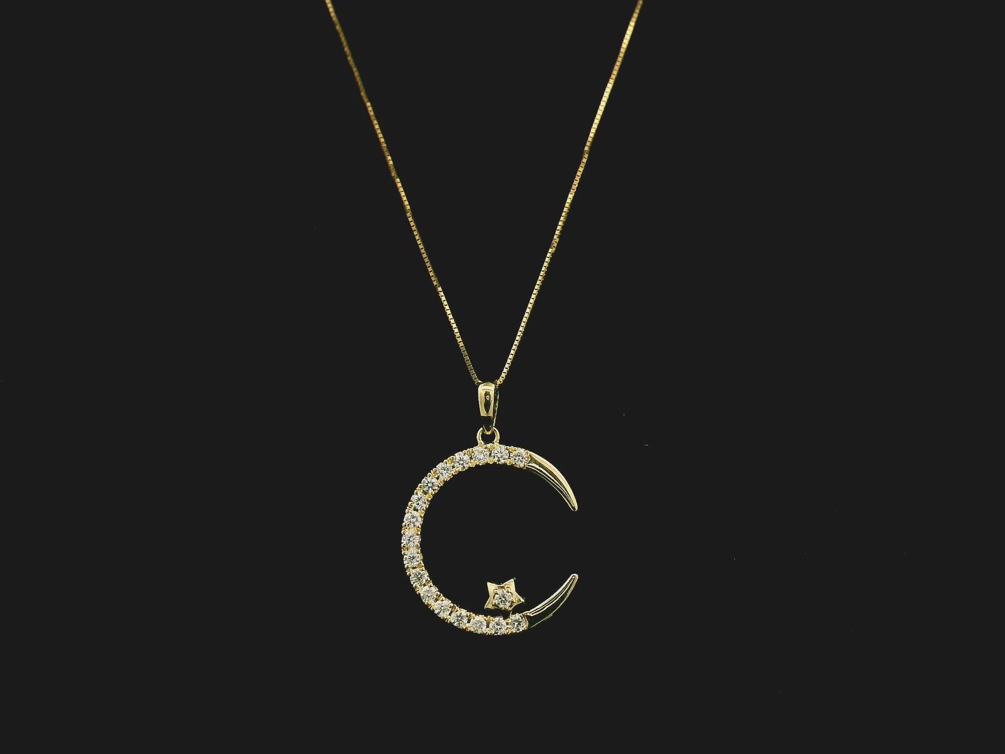Diamond crescent moon pendant in 18K yellow gold by Emirates Diamonds