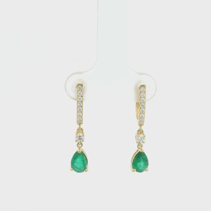 18K Yellow Gold Emerald Drop Earrings featuring 1.00 carat natural pear-shaped emeralds suspended from diamond huggie hoops with 0.31 carat natural diamonds.