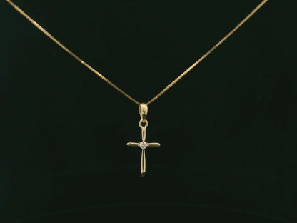 0.02 carat diamond cross pendant in 18K yellow gold minimalist necklace by Emirates Diamonds