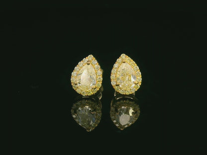 Pear-shaped fancy yellow diamond halo earrings in yellow gold setting