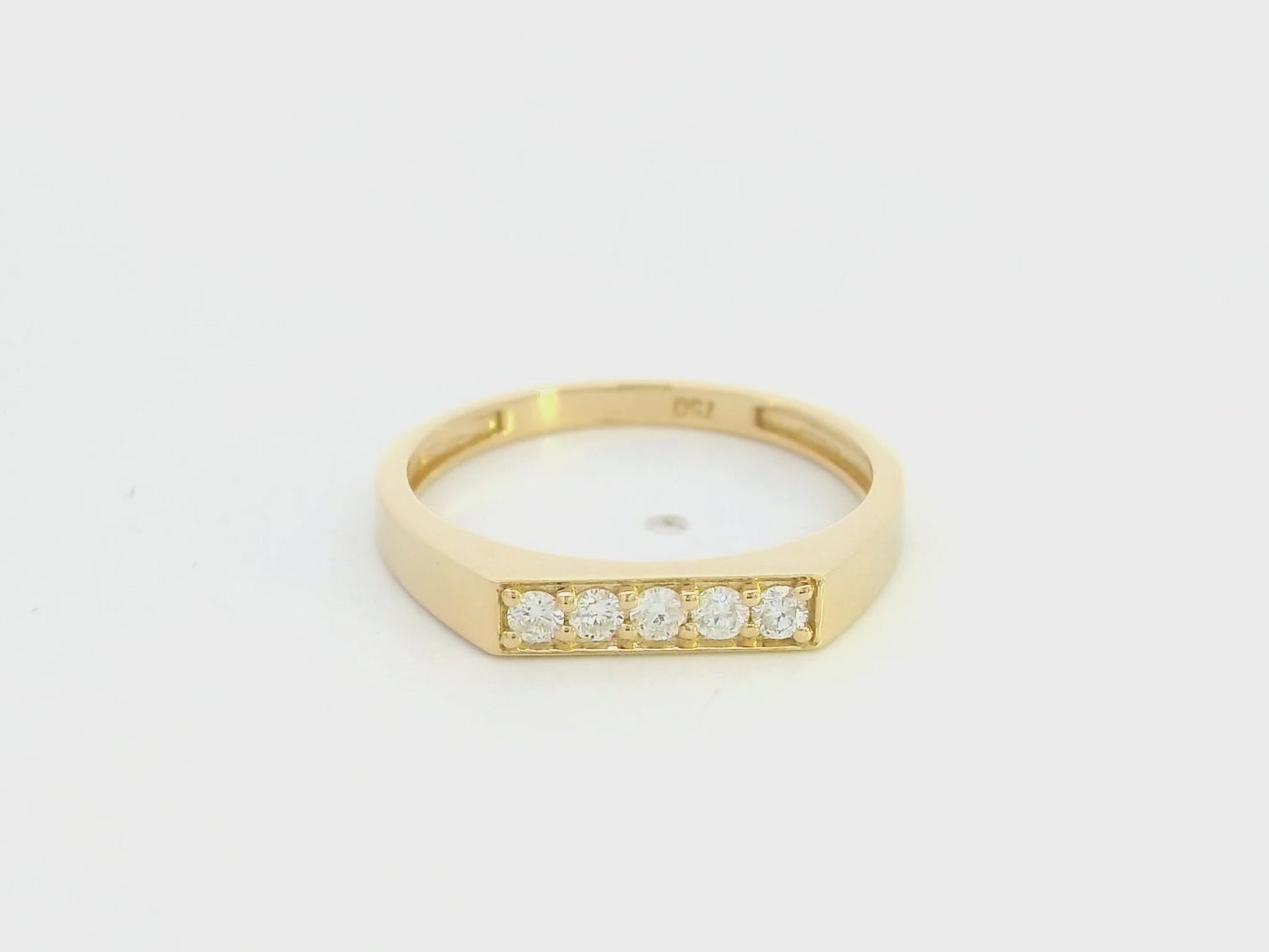 18K yellow gold diamond bar band ring with modern minimalist design.