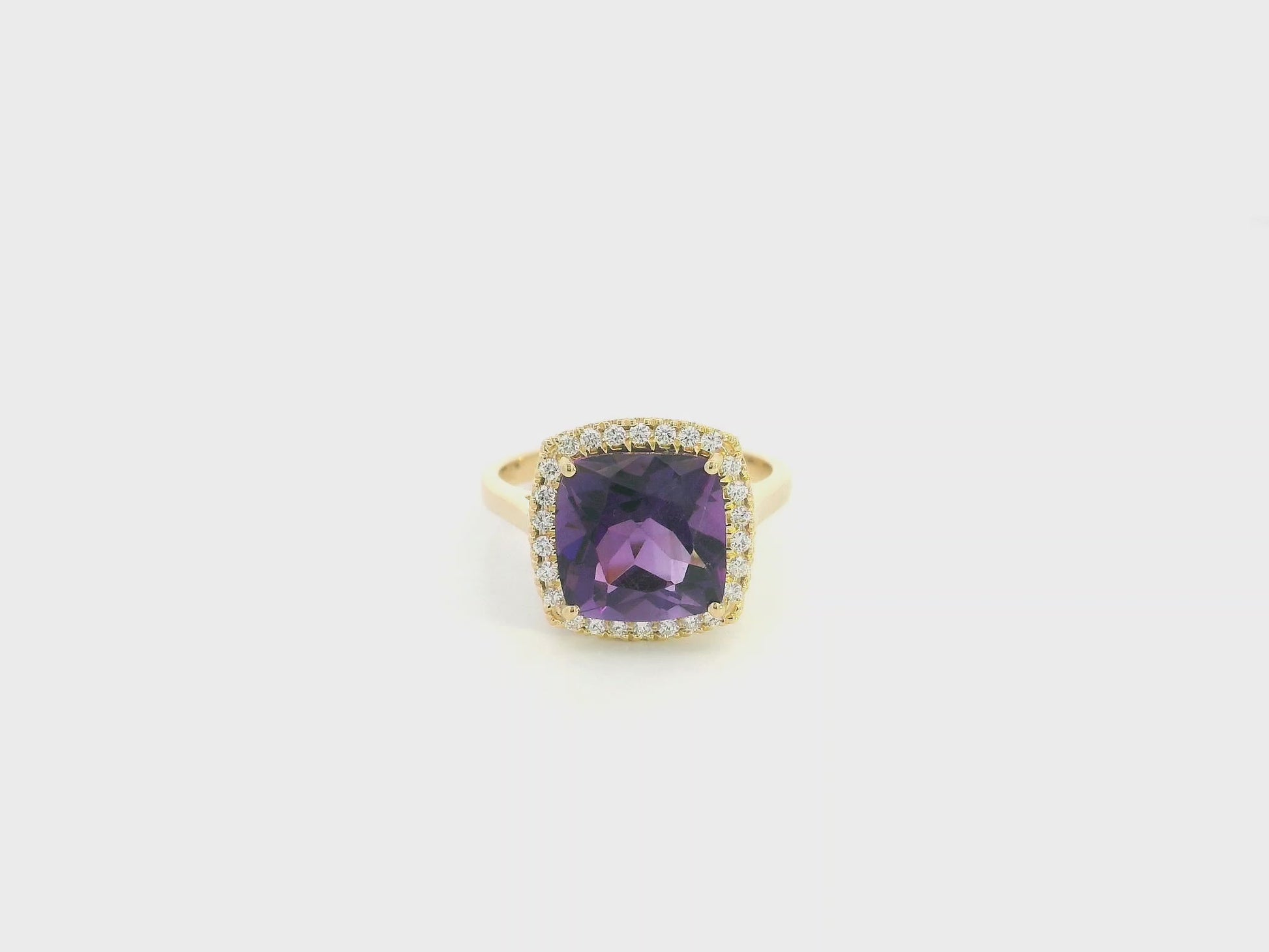 18K yellow gold cushion-cut amethyst halo ring with natural diamond accents.