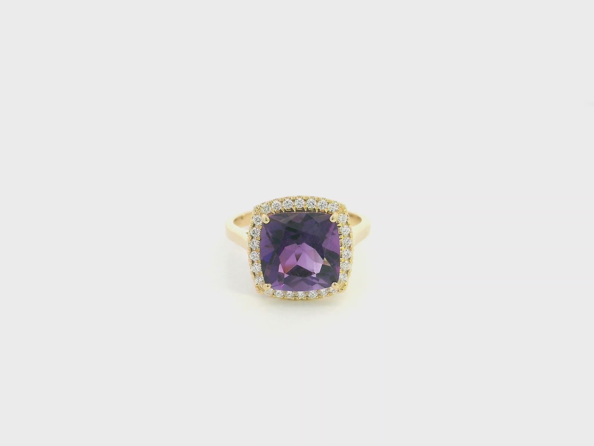 18K yellow gold cushion-cut amethyst halo ring with natural diamond accents.