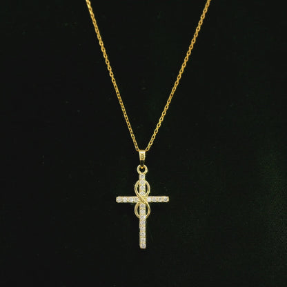 Diamond cross pendant in 18K yellow gold with round brilliant diamonds and an intertwined gold centre design