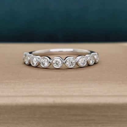 Bezel Set Half Eternity Diamond Ring In 18k White Gold.