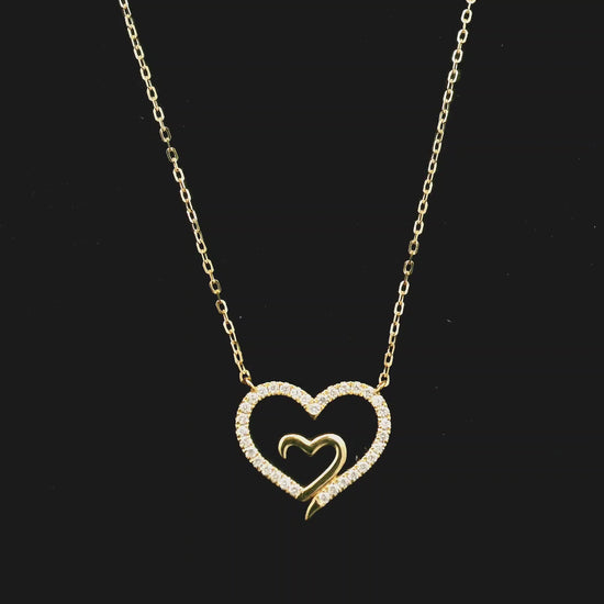 18K yellow gold open heart diamond necklace with pavé diamonds and modern romantic design.