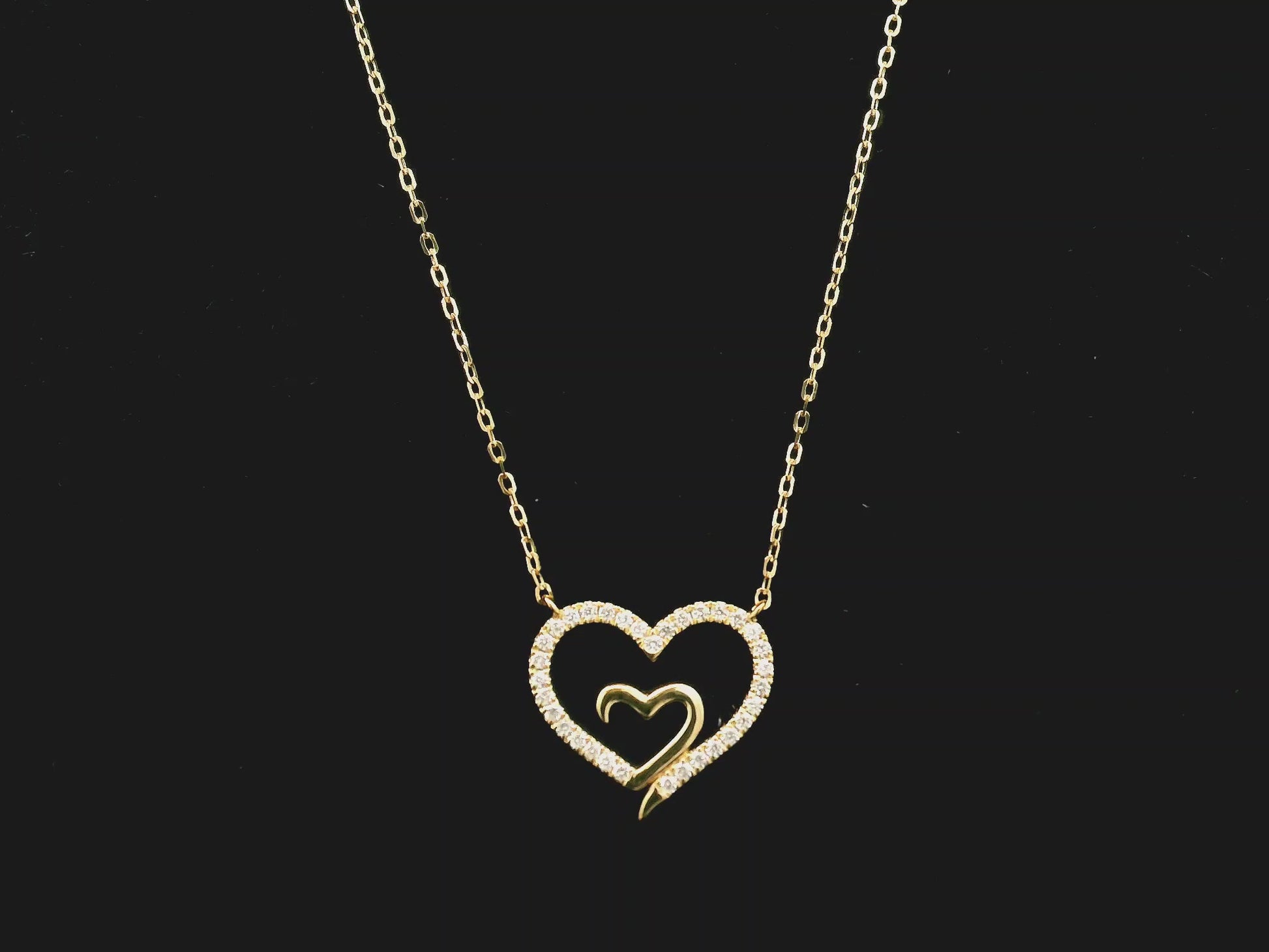 18K yellow gold open heart diamond necklace with pavé diamonds and modern romantic design.