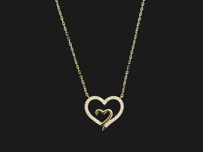 18K yellow gold open heart diamond necklace with pavé diamonds and modern romantic design.