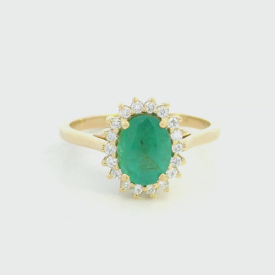Oval emerald diamond halo ring in 18K yellow gold by Emirates Diamonds
