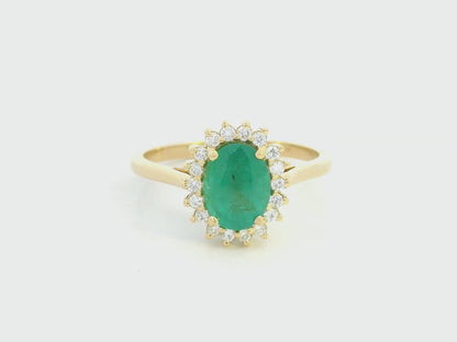 Oval emerald diamond halo ring in 18K yellow gold by Emirates Diamonds