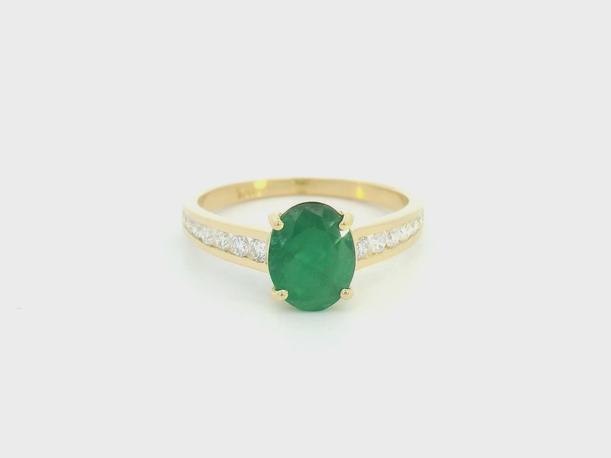 Oval emerald and diamond ring in 18K yellow gold by Emirates Diamonds