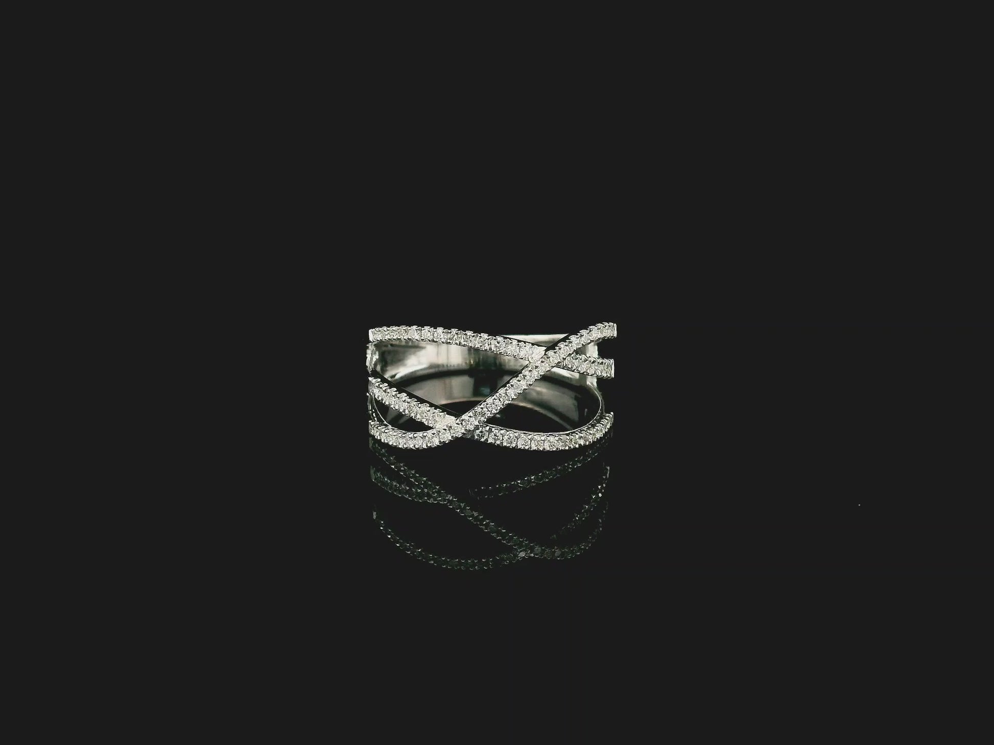 18K white gold diamond criss cross ring with pavé-set crossover bands.