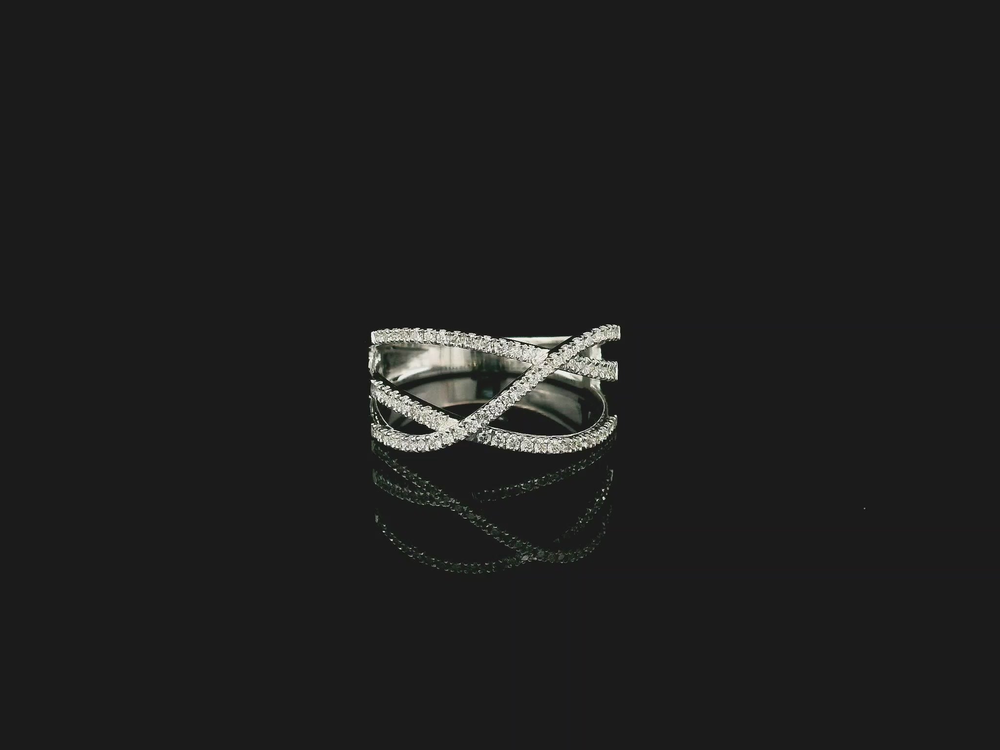 18K white gold diamond criss cross ring with pavé-set crossover bands.