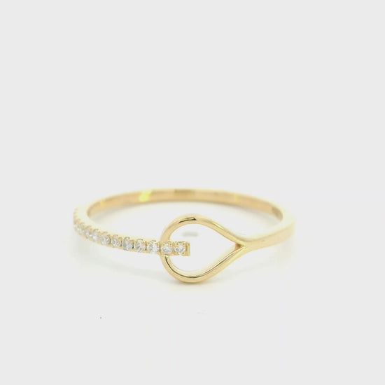 18K yellow gold open teardrop diamond ring with minimalist modern design.