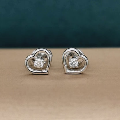 Solitaire Diamond Stud Earrings Set In Heart Shape In 18k White Gold.