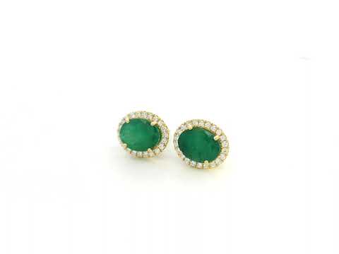 18K yellow gold emerald and diamond halo stud earrings with oval emeralds and brilliant diamond accents by Emirates Diamonds.